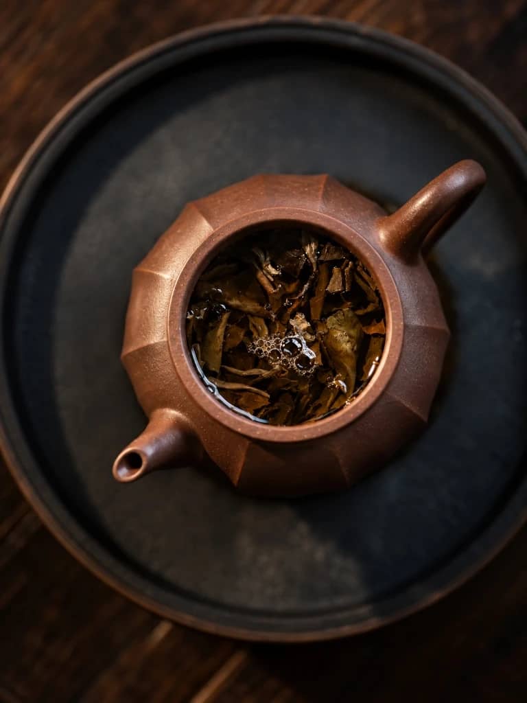 Clay teapot with whole tea leaves steeping inside for the Summer Set